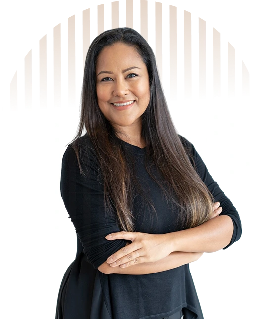 Confident female virtual contractor assistant with arms crossed standing in front of a circular striped background